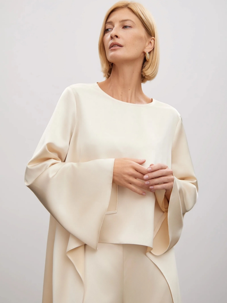 Блуза из тенсела ,
80% полиэстер, 20% вискоза ,