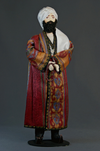 Кукла сувенирная фарфоровая. Мужчина в традиционном узбекском костюме.