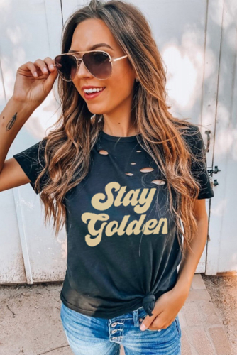 Черная футболка с дырками и надписью: Stay Golden