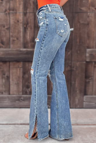 Потертые рваные джинсы с разрезами