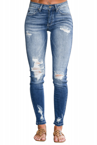 Голубые потертые облегающие джинсы с дырками