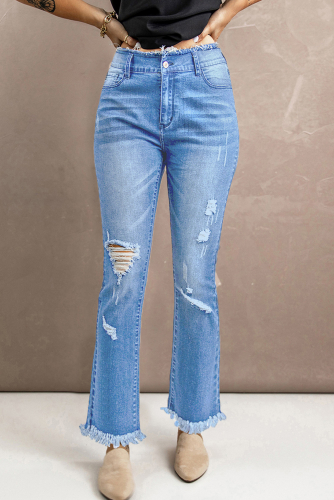 Голубые потертые рваные расклешенные джинсы с высокой посадкой