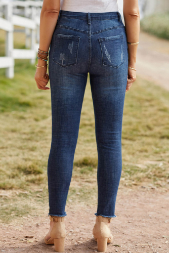 Синие джинсы-скинни на пуговицах с потертостями и дырками