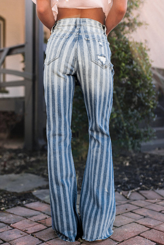 Голубые джинсы-клеш в полоску со стиркой и потертостями