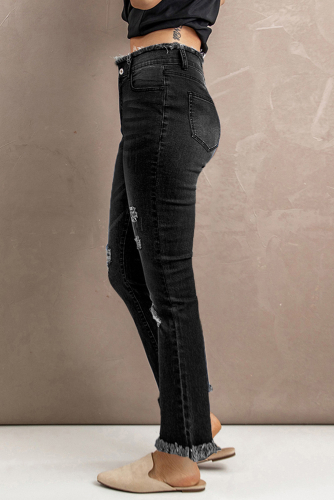 Черные потертые рваные расклешенные джинсы с высокой посадкой
