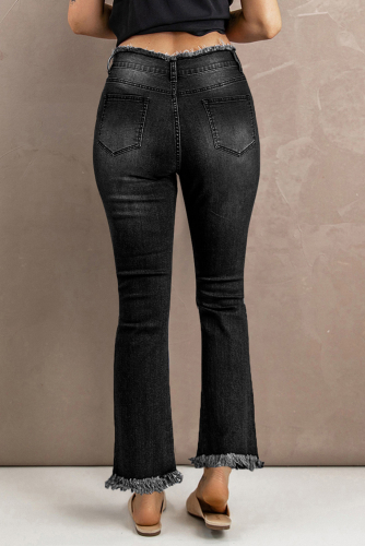 Черные потертые рваные расклешенные джинсы с высокой посадкой