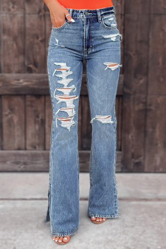 Потертые рваные джинсы с разрезами