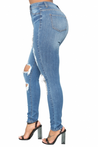 Голубые джинсы-скинни с потертостями и разрезами