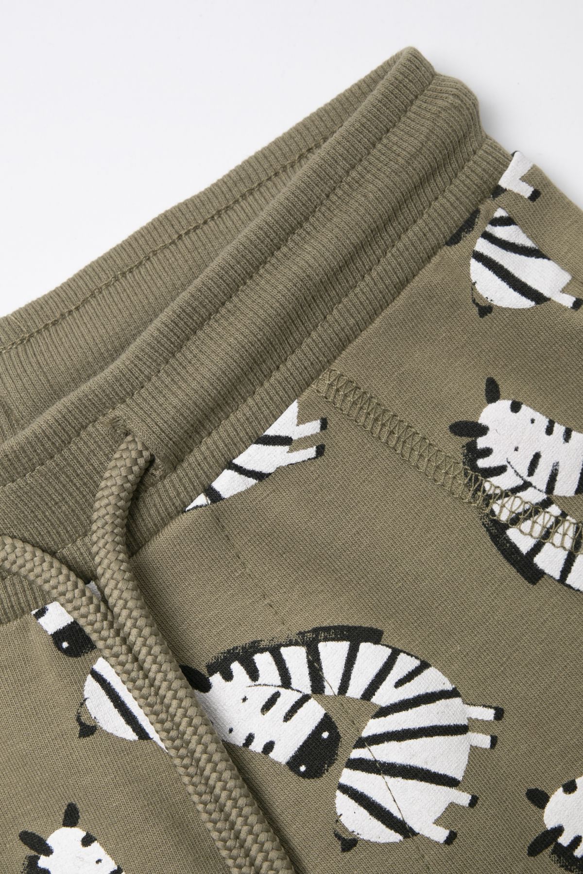 -39% Legginsy z długą nogawką khaki w żyrafy