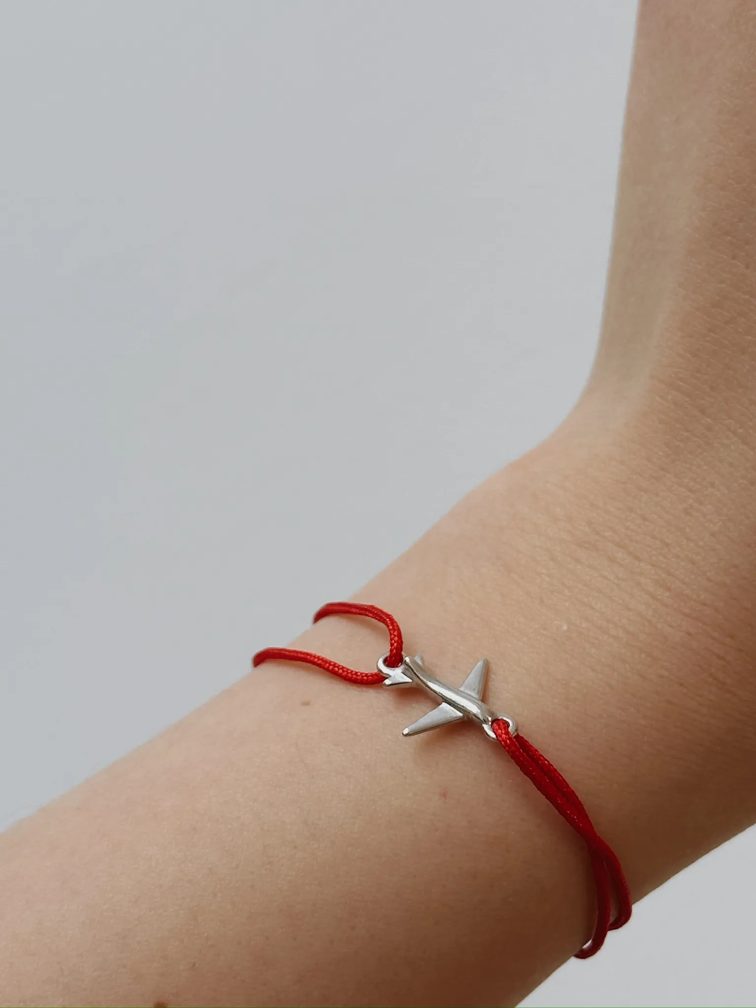 Серебряный браслет на нити «Самолет»
