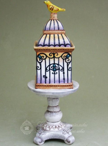 Клетка с канарейкой