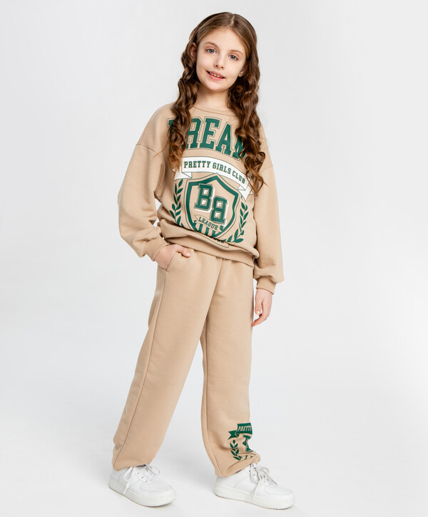 1600 р.  2000 р.  Джоггеры с принтом бежевые для девочки Button Blue