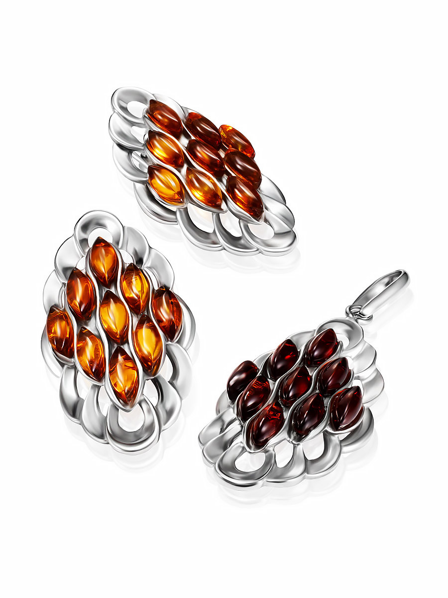 Эффектные оригинальные серьги «Крылышко», украшенные янтарными вставками
